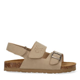 Beige sandal with embossed CK logo strap, silver-toned buckle strap, velcro heel strap, cork midsole, rubber outsole.