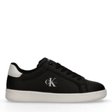 Black low-cut lace-up sneaker with white sole and heel tab. Features a white Calvin Klein logo on the side.