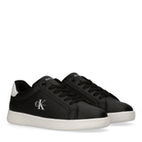Pair of black low-cut lace-up sneakers with white soles, white Calvin Klein 'ck' logo on the side, and white heel tabs.