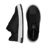 Pair of black low-cut slip-on sneakers with smooth uppers, elastic vamp strap, white midsoles, and brown outsoles. 'ck' logo.
