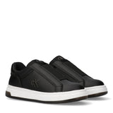 Black low-cut slip-on sneakers with white soles, elasticated vamp straps, and Calvin Klein 'CK' logo details.