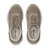 Pair of beige low-cut lace-up sneakers with mesh uppers, synthetic overlays, white midsoles, and Calvin Klein insoles.