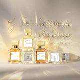 Clear glass rectangular perfume bottle with amber liquid, white label, and a gold-toned rectangular cap.
