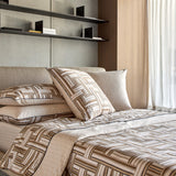 Duvet cover set with brown, beige, and white geometric interwoven stripes, dark piping, and a subtle grid pattern.