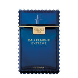 Versace Man Eau Fraîche Extrême perfume bottle in deep blue translucent glass with distinct serrated edges, a matching blue cap, and gold lettering.