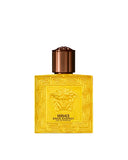 A vibrant yellow Versace Eros Energy 50ml perfume bottle featuring an embossed Medusa head and Greca border, shown alongside its matching gold-and-yellow designer box.