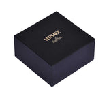 A closed, square black gift box featuring the Versace and Rosenthal logos in gold foil.