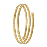 A vertical side-profile view of the coiled gold-plated bracelet, showing the seamless flexibility, uniform spacing, and high-shine end caps of the multi-tiered design.