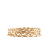 Set of five gold-toned metal bangles with a wavy, textured surface, each adorned with numerous round, clear handset stones.
