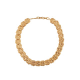 Gold-toned statement necklace featuring a series of textured, irregular coin-like elements linked together, with a chain exte