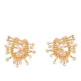 Pair of gold-toned stud earrings with a sculptural wave design, each embellished with multiple clear, round stones.