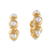 Pair of gold-toned hammered hoop earrings, each adorned with multiple white spherical pearls set within the textured metal.
