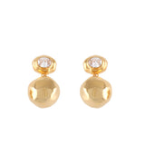 Pair of gold-toned dangling earrings, each featuring an irregular oval stud with a clear round stone and a larger, irregular