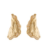 Pair of large gold-toned petal-shaped hoop earrings with a textured surface and clear handset stones along the edges.