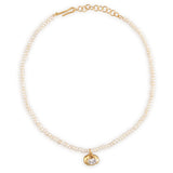 White pearl choker with a gold-toned oval pendant featuring a clear stone, and a gold-toned hook clasp with extender chain