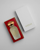 Perfume bottle with gold cap in red box and 'WIDIAN' branded box on gray background.