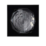 Decorative headband with floral elements on a black background.
