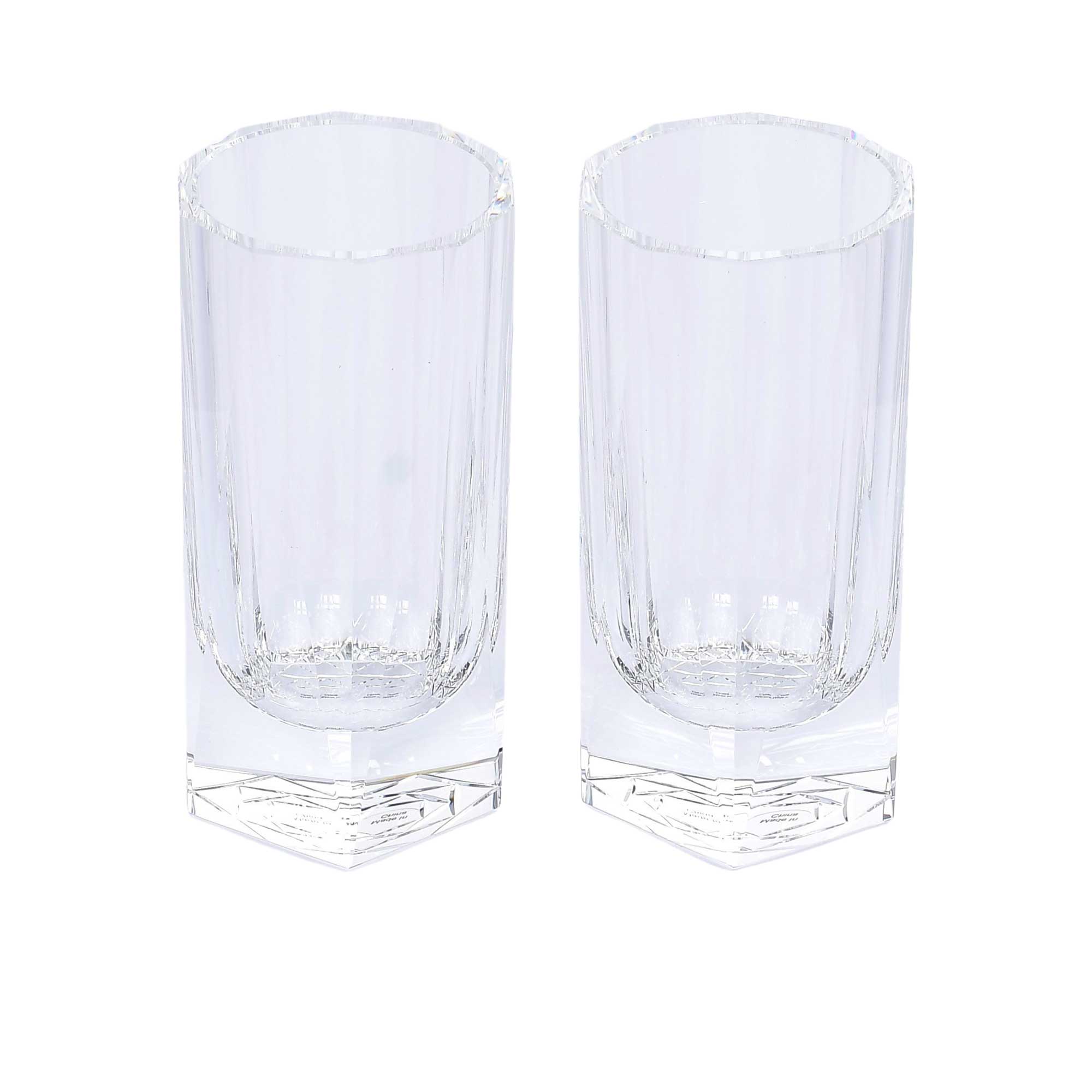 A pair of clear, modern highball glasses featuring vertical crystalline cuts and a thick hexagonal base.