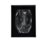 Crystal tumbler in a black box on a white background.