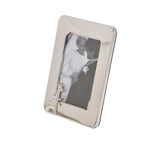 A perspective view showing the black velvet easel back and the slim profile of the silver frame.