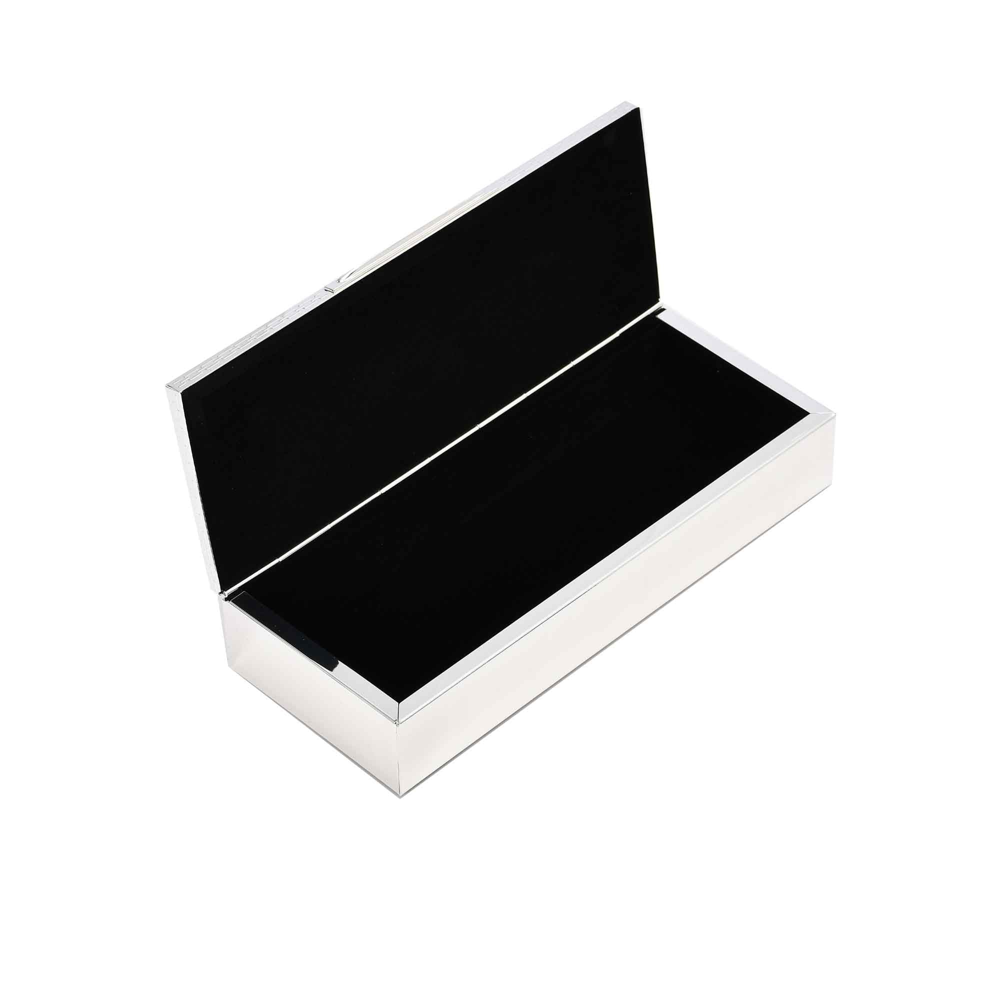 The silver Winko box opened to show the contrast between the turquoise exterior and the dark black velvet-lined interior.