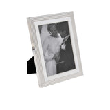 Silver photo frame with a black and white photograph of a couple on a white background