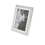 White picture frame with a photo of two people on a white background