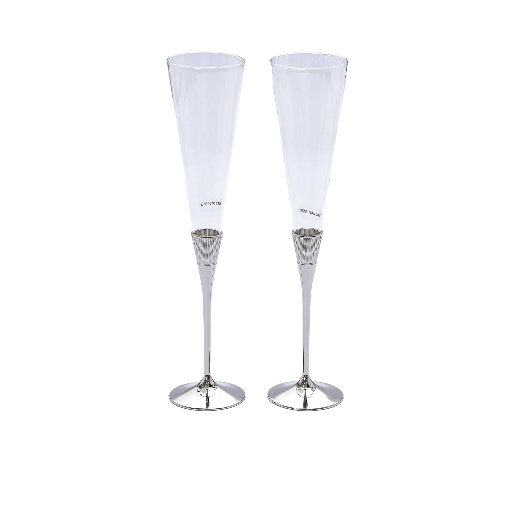 A pair of tall, clear crystalline highball glasses with detailed vertical ridges and a thick glass base on a white background.