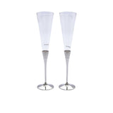 A pair of tall, clear crystalline highball glasses with detailed vertical ridges and a thick glass base on a white background.