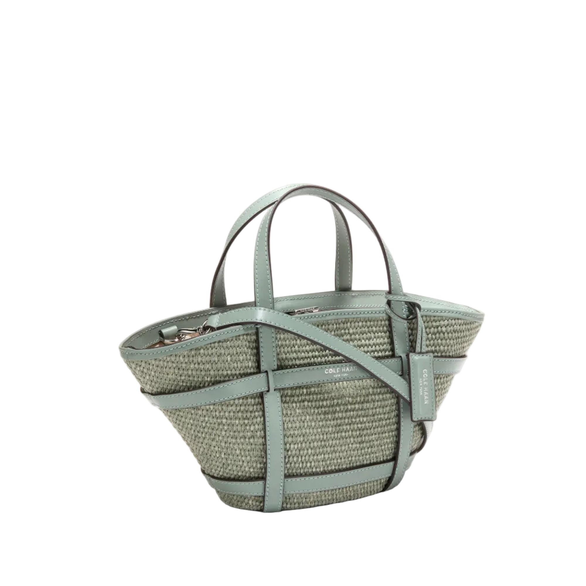 Women's Key West Tote Crossbody Bag Light blue woven handbag with leather straps on a white background