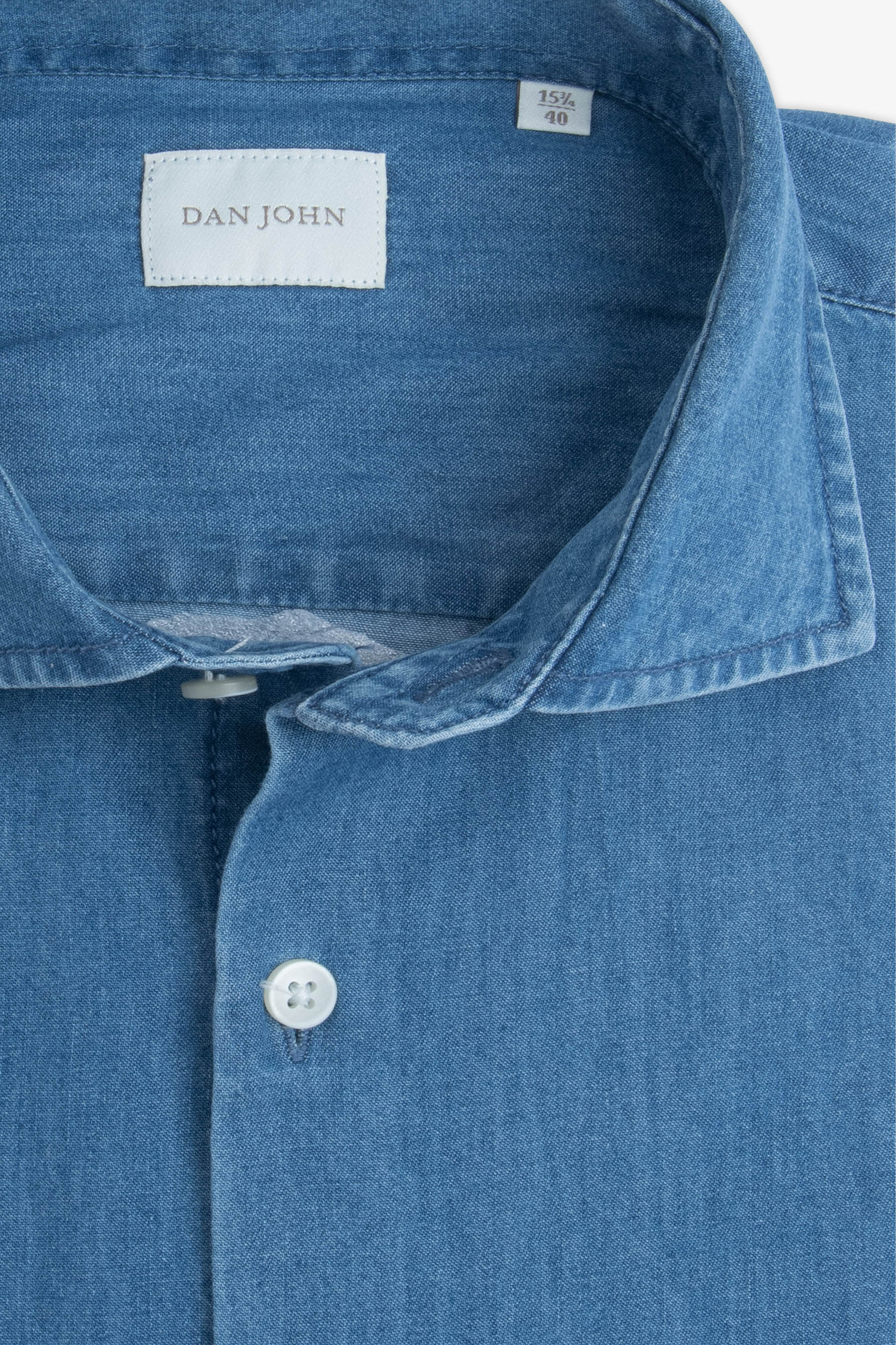 Light blue chambray shirt with a spread collar and white buttons.