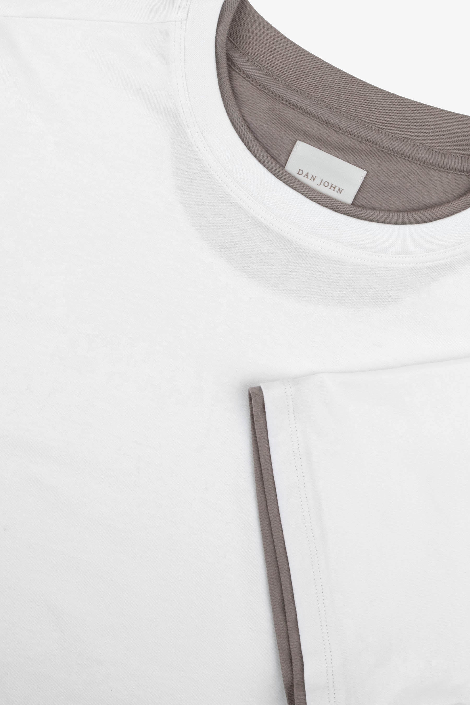 Panna crew neck t-shirt with contrasting grey inner collar and sleeve cuff. 'DAN JOHN' label.