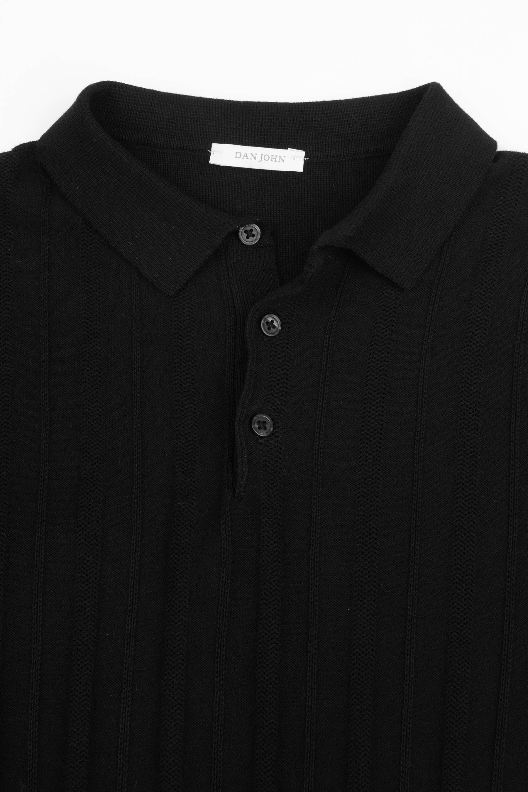 Black knit polo shirt with a ribbed collar, three-button placket, and vertical textured stripes.