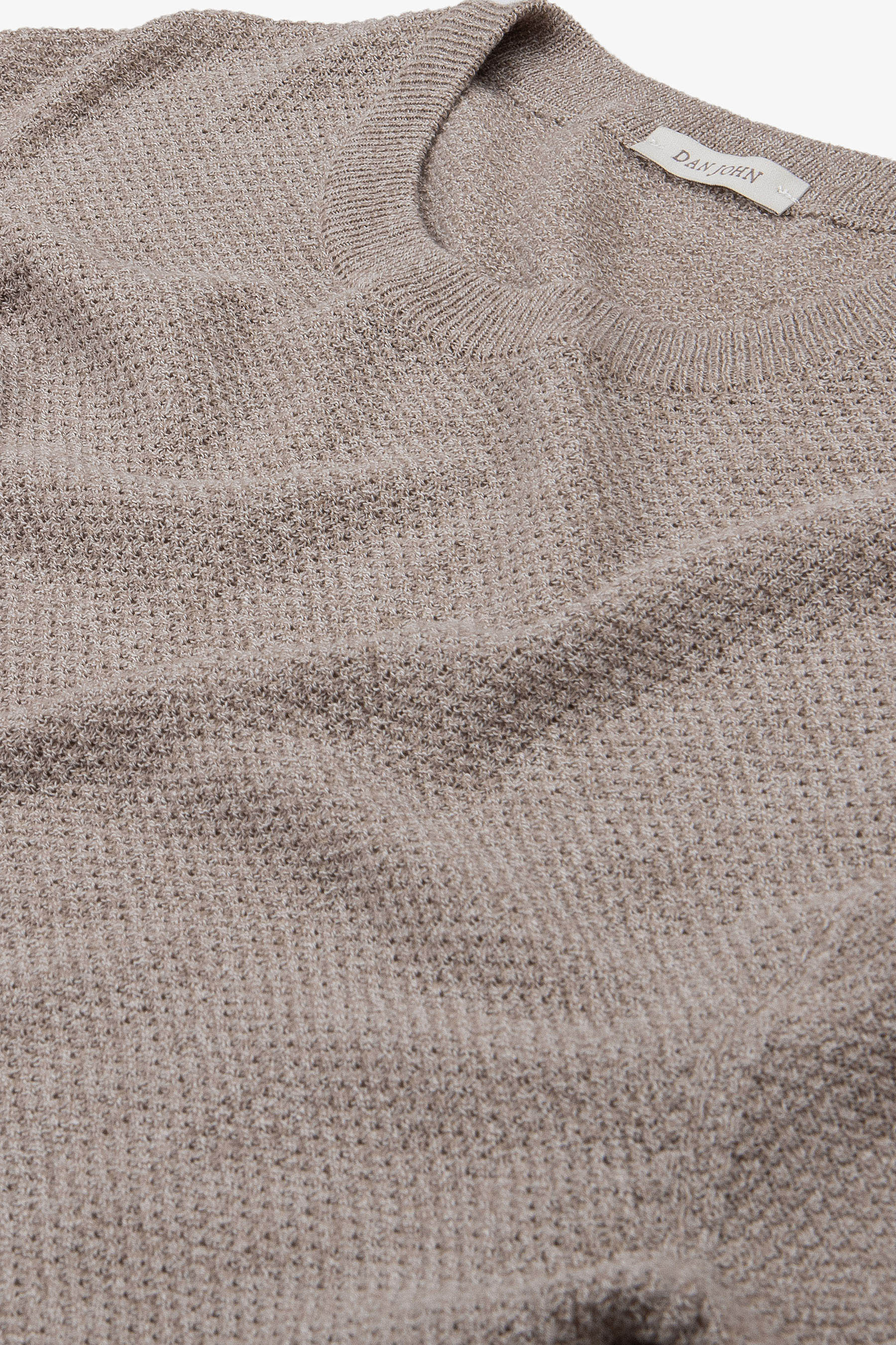 Taupe short-sleeve knit top with a textured, slightly open weave and ribbed crew neck.