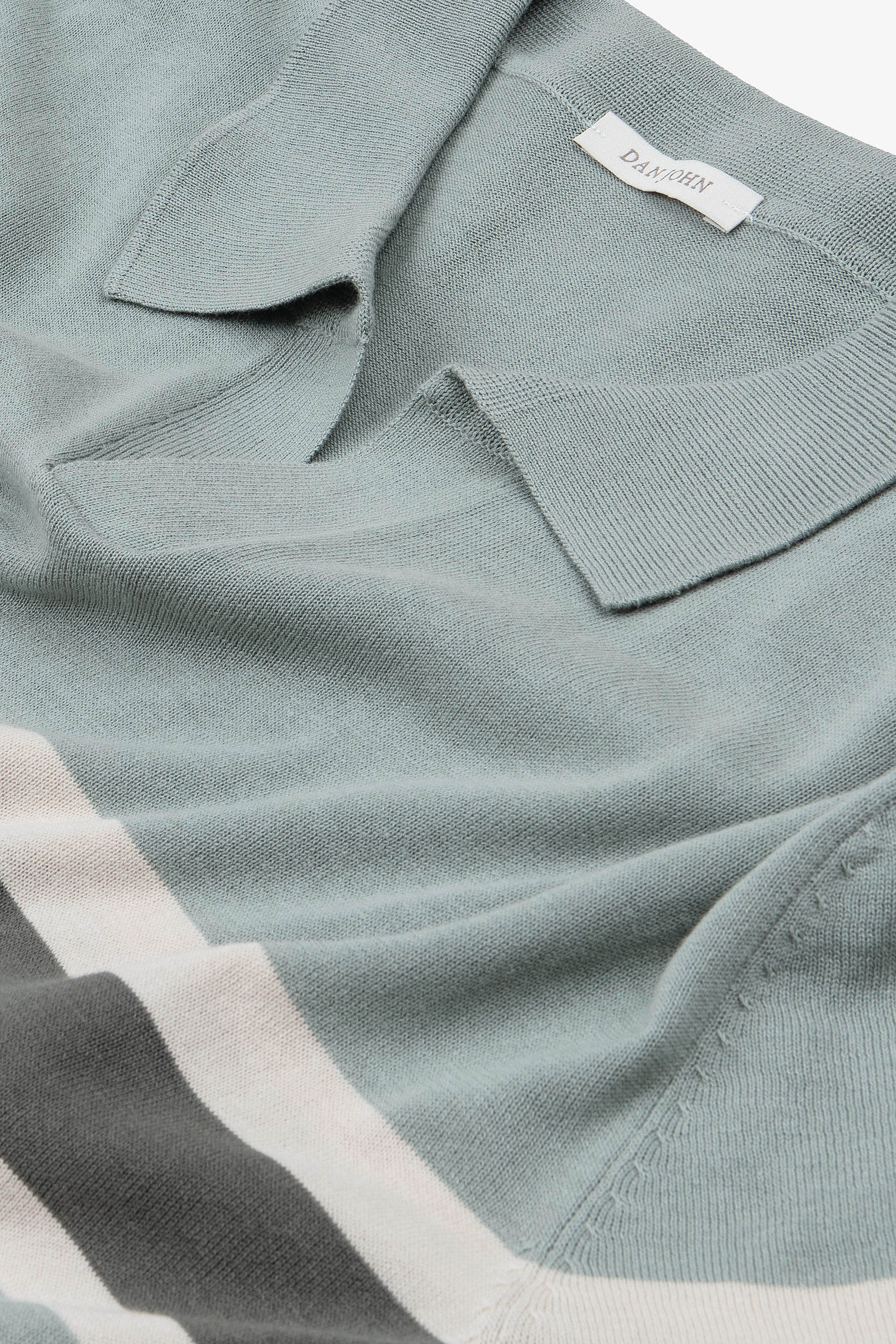 Light green fine knit polo shirt with an open collar and horizontal stripes in light beige and dark grey.