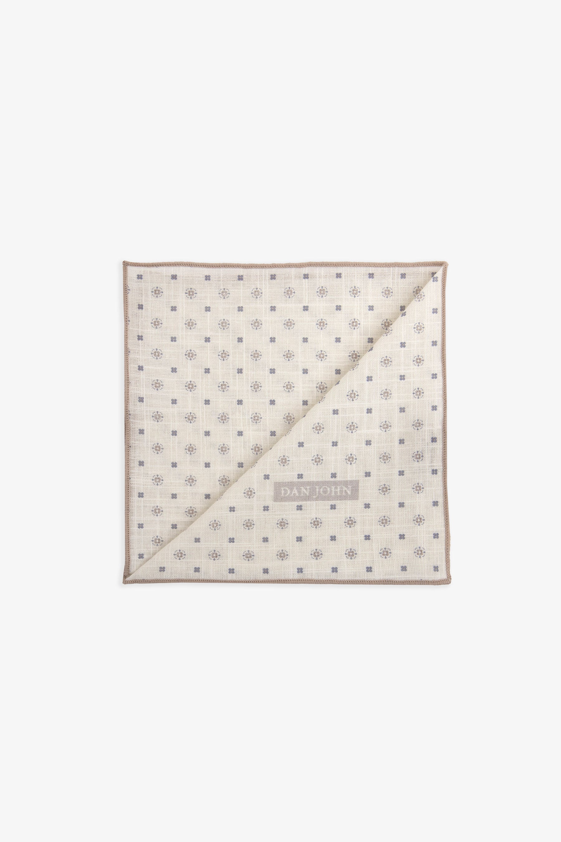 Ecru handkerchief with grey geometric and floral pattern and taupe stitched border, folded diagonally.