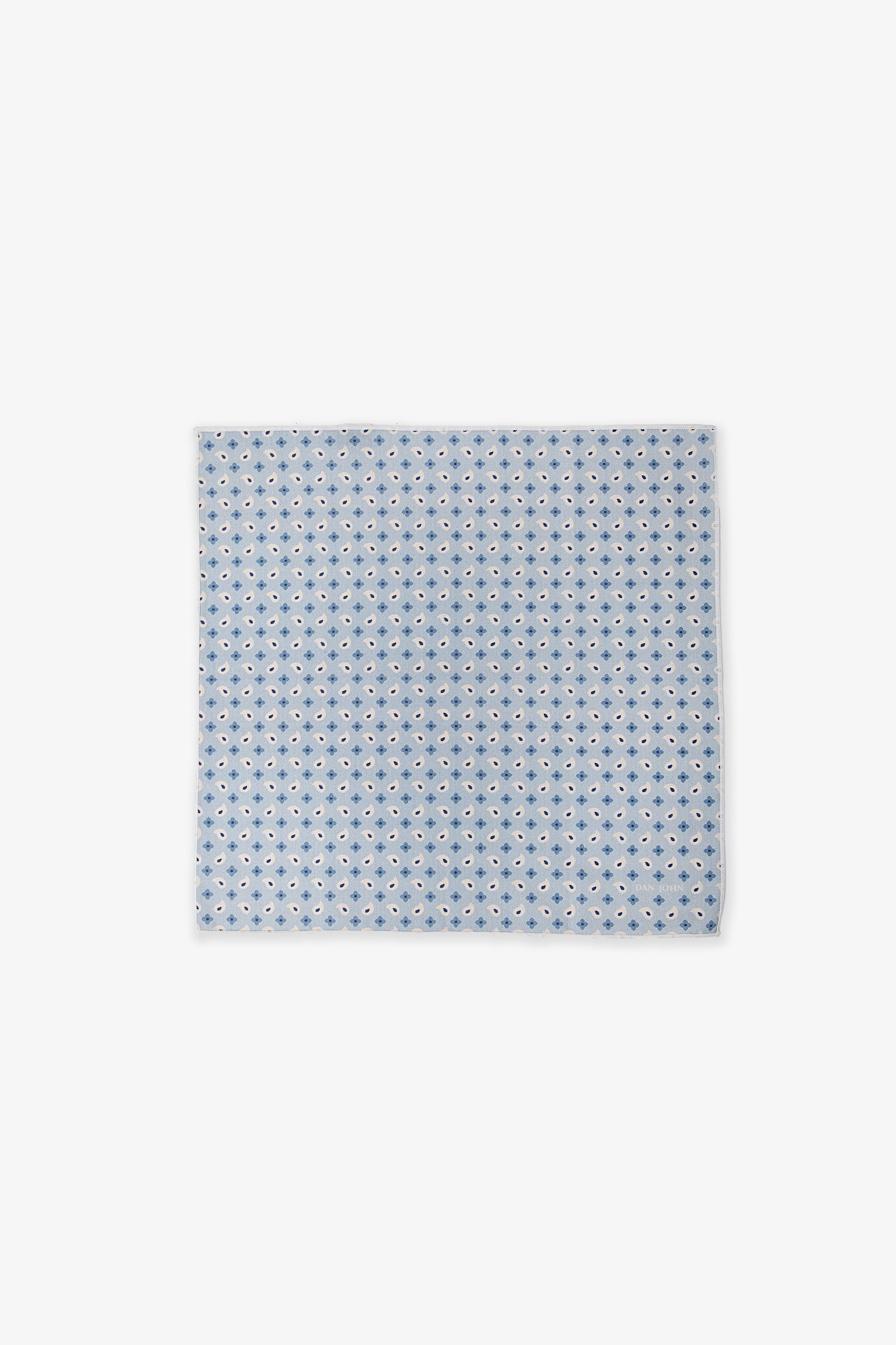Light blue square handkerchief with a repeating pattern of dark blue, light blue, and white stylised four-petal flower motifs