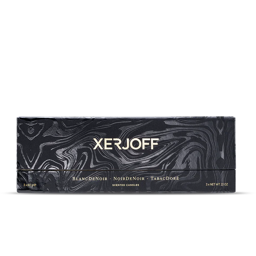 A long, elegant black presentation box for the Xerjoff Trittico Nero candle set, featuring a silver-grey marbleized swirl pattern and gold-stamped branding for the three included scents.