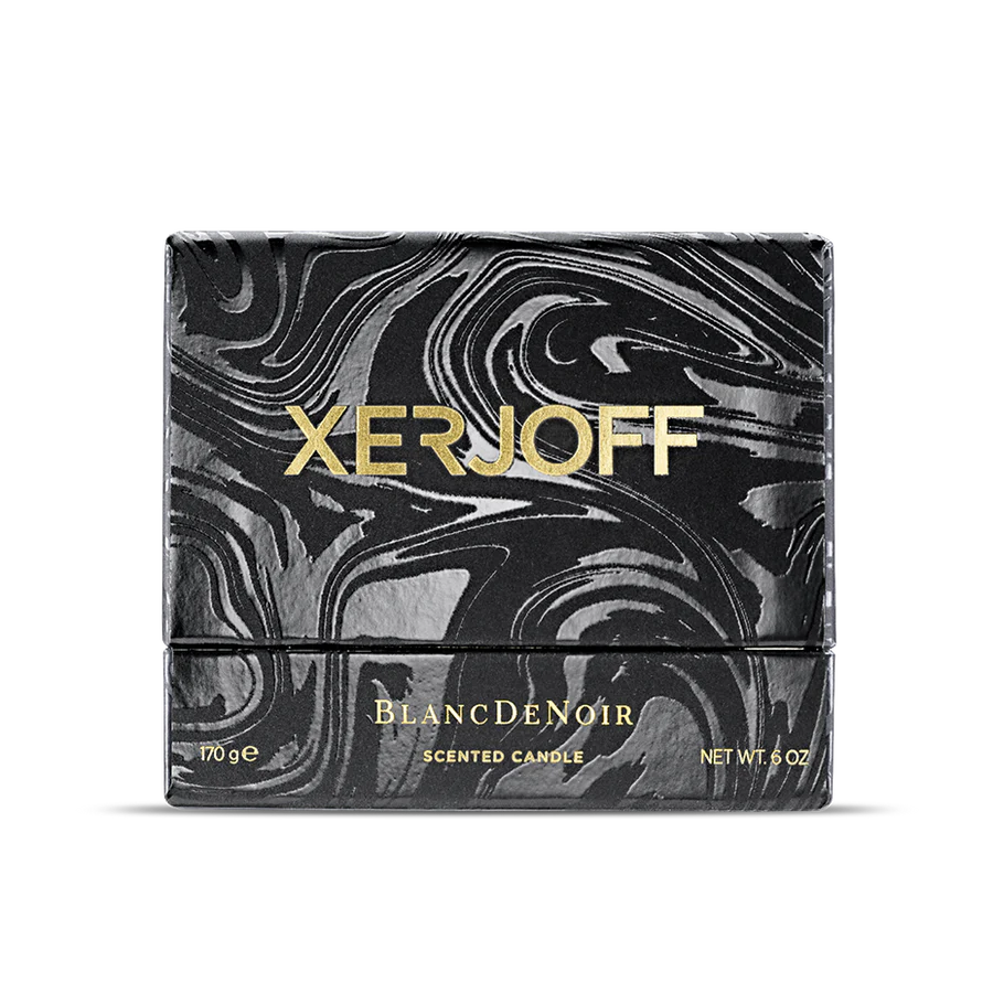 The luxury packaging for the Xerjoff Blanc De Noir candle, featuring a white and grey marble-patterned box with a prominent gold "X" logo and gold-stamped product name.
