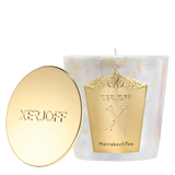 The Marrakech Tea scented candle in a tapered emerald green glass holder, showcasing a gold star-patterned label and the embossed Xerjoff emblem.