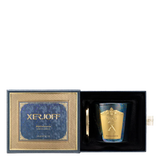 The luxury packaging for the Xerjoff Midgardenia candle, featuring an ivory and soft grey marble-patterned box with gold-foil accents and the brand's iconic "X" logo.