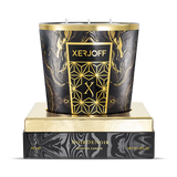 The 750g Noir De Noir scented candle showcased in its open, felt-lined presentation box, highlighting the large-scale black glass holder with its intricate gold star-patterned label.
