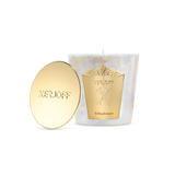 An iridescent white glass candle holder featuring a large gold decorative shield with the Xerjoff "X" logo, shown next to a polished gold lid embossed with the brand name.