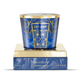 The Xerjoff TrueBlue 170g scented candle displayed on its gold and blue base. The glass features a deep blue marbled design with a gold crest and rim.