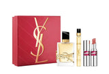 Red YSL Libre Eau de Parfum gift set box with gold-toned logo, containing a clear glass perfume bottle, a gold-toned travel s