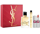Red YSL Libre Eau de Parfum gift set with a large bottle, a travel spray, and two lipsticks in nude and berry shades.