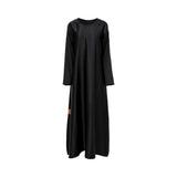 Front view of the black inner dress showing the sleek, floor-length silhouette and high-quality finish.