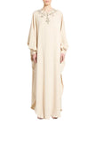 Model wearing Zuhair Murad ivory crystal-embellished long-sleeve kaftan gown available at BLUE SALON.