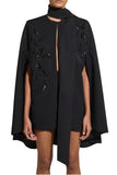 Zuhair Murad black embroidered cady cape top featuring a dramatic high-neck scarf tie and intricate floral beadwork detailing available at BLUE SALON.