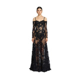 Front studio portrait of a model showcasing the sheer black Zuhair Murad off-the-shoulder evening gown with intricate floral lace appliqués, from the BLUE SALON shop.